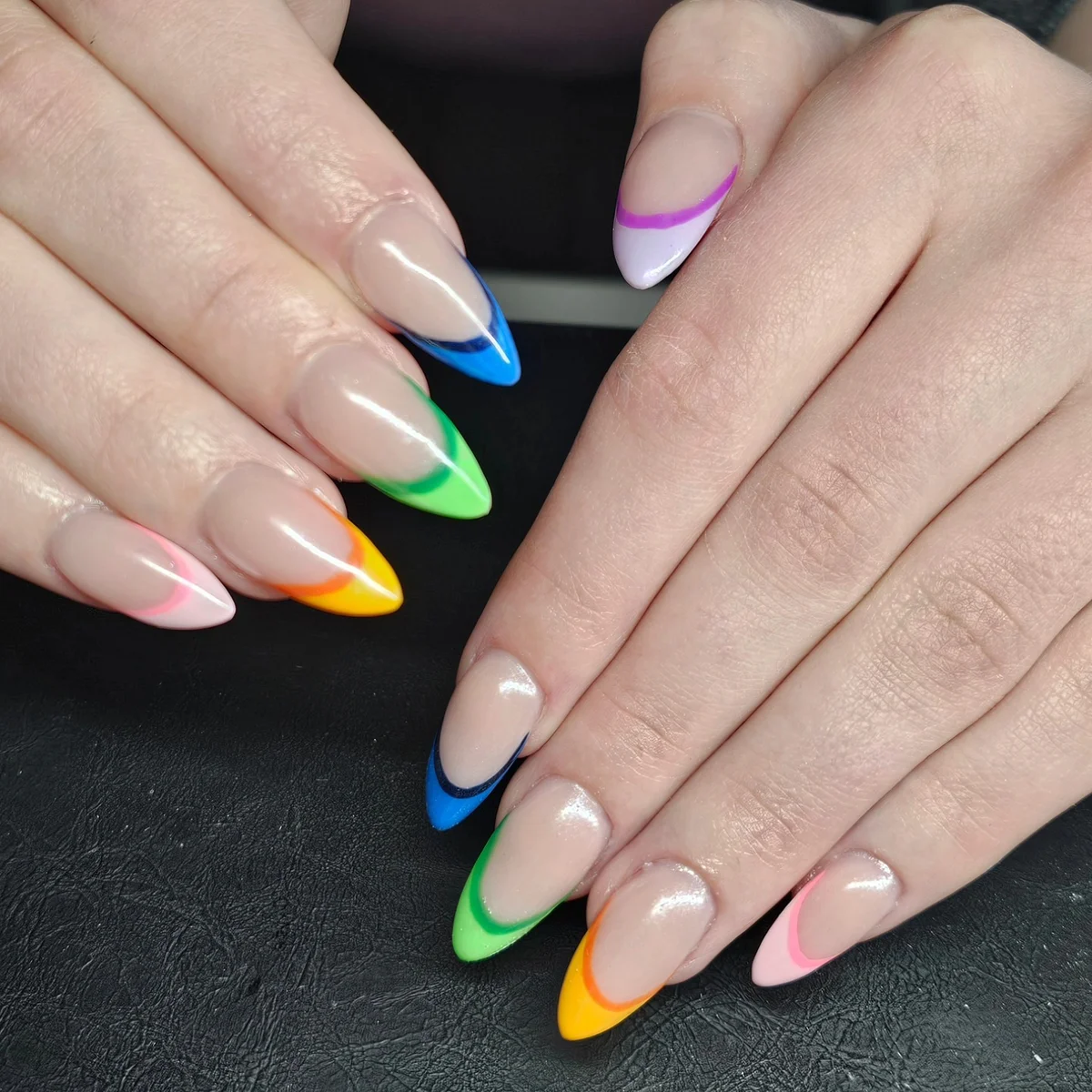 Nude almond nails with individual bright multicoloured tips
