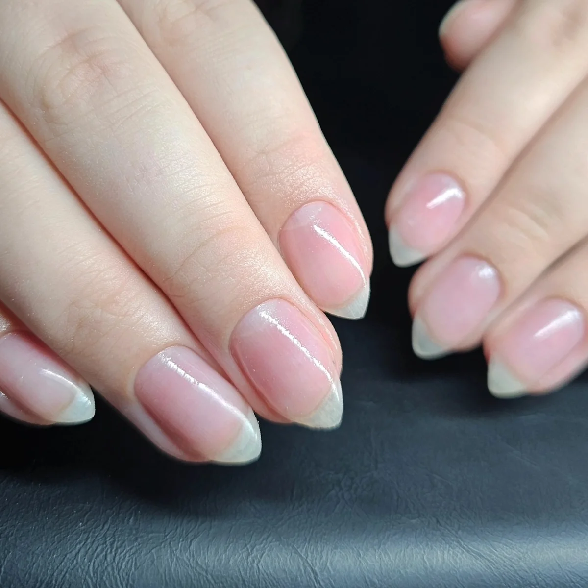 Pink almond nails with fine white French tips