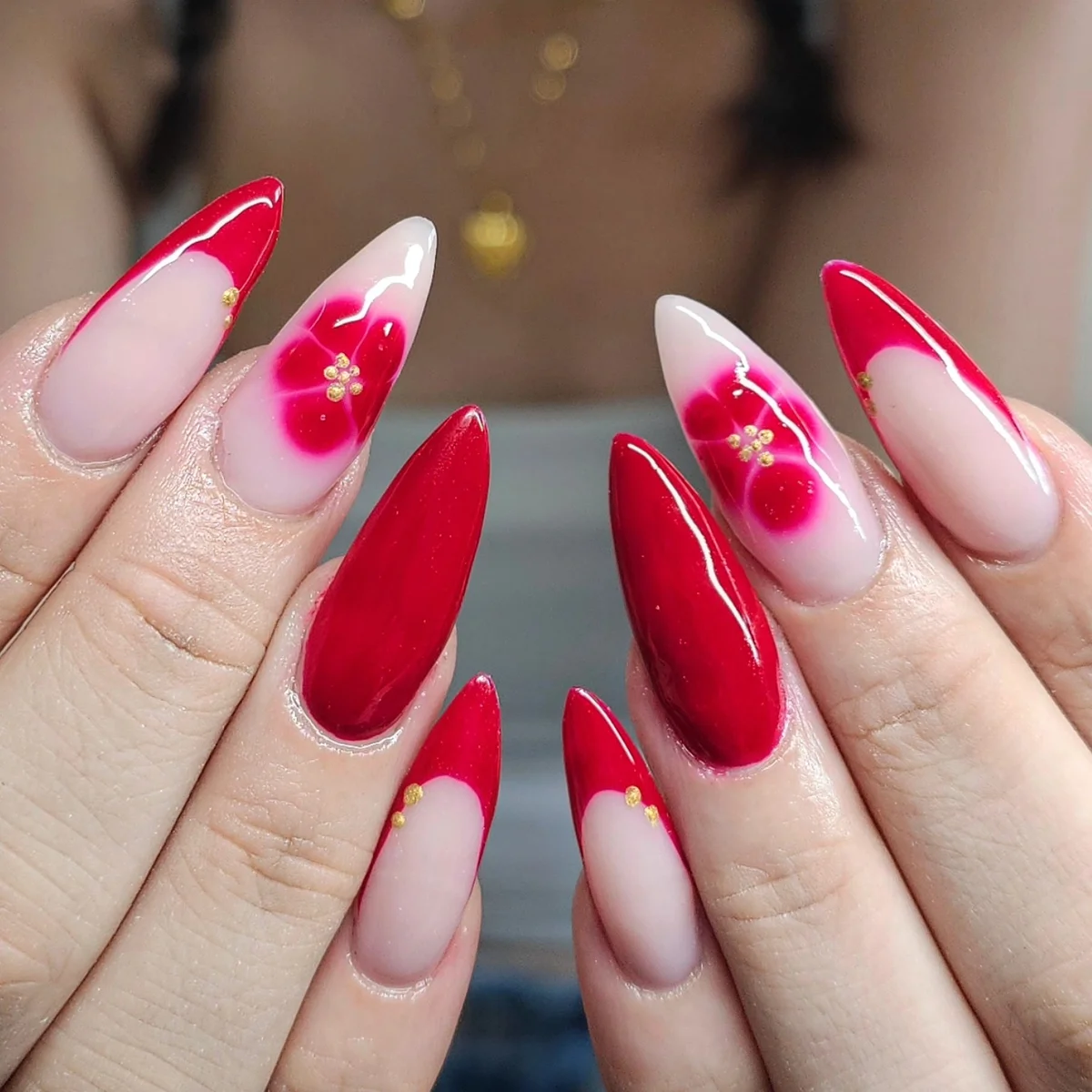 Long red French tips with red flower accents