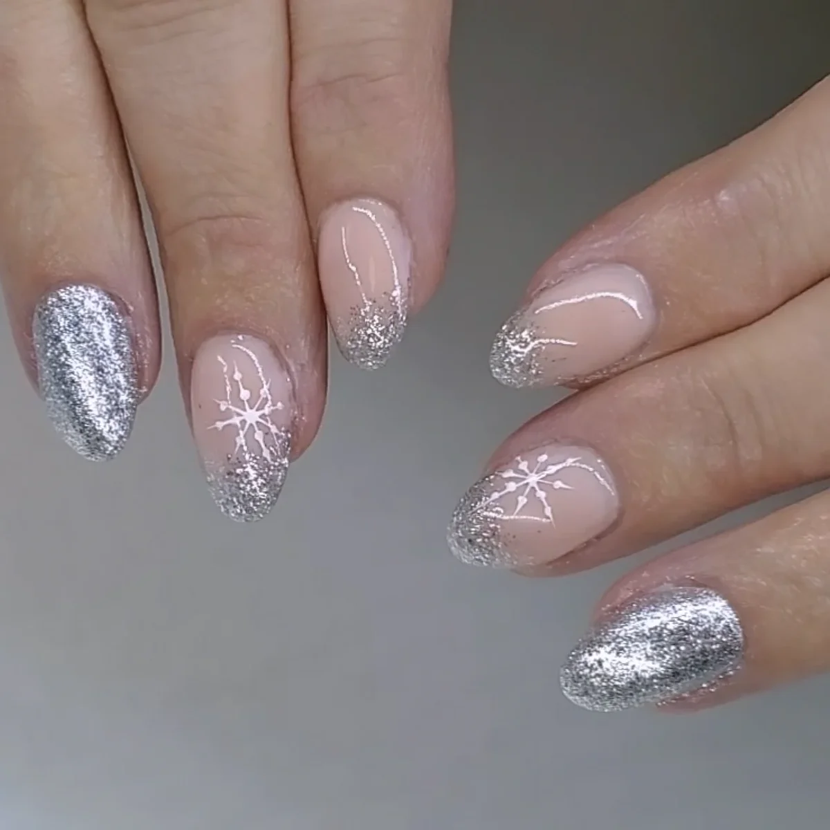Pink and silver nails with glitter and delicate white lines